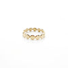 Second close up of handcrafted designed jewelry 14 carat gold dot ring on a white background