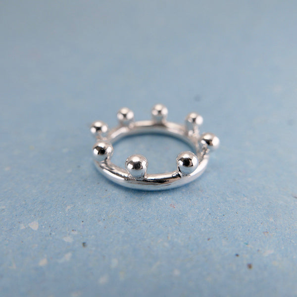 Close up of handcrafted silver ball crown ring. Jewelry designed and crafted on Granville Island.
