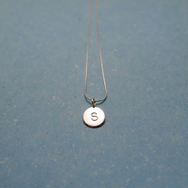 Sterling silver handmade pendant of stamped letter s on chain by Granville Island Vancouver Canada Silversmith.