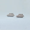 Close up of sterling silver cruise ship cufflinks on blue background by Silversmith Granville Island Artisan.