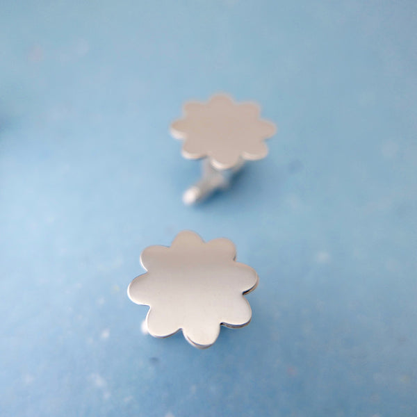 Sterling silver flower cufflinks in perspective view by Hammered & Pickled  Jewelry.