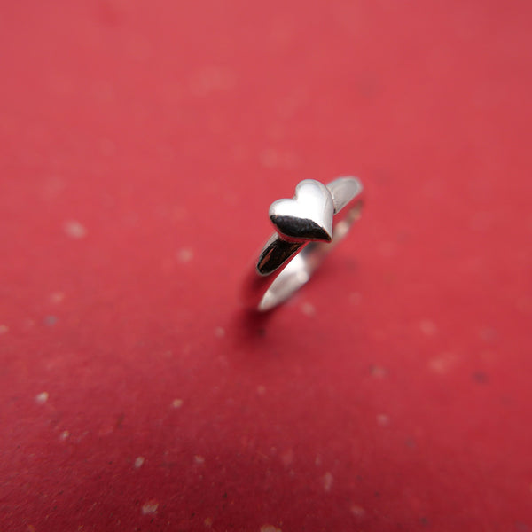 Top view of silver heart ring by Hammered & Pickled Jewelry.