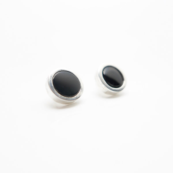 Close up of Black Onyx circle earrings, made in Canada by Granville Island Silversmith.