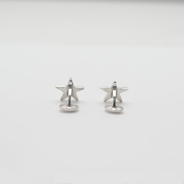 Silver star cufflinks from the back view showing the cufflinks clasps.