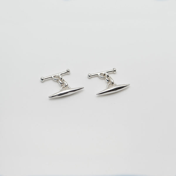 Top view of silver torpedo cufflinks showing the clasps.