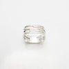 Close up top view of handmade silver Vancouver house ring.