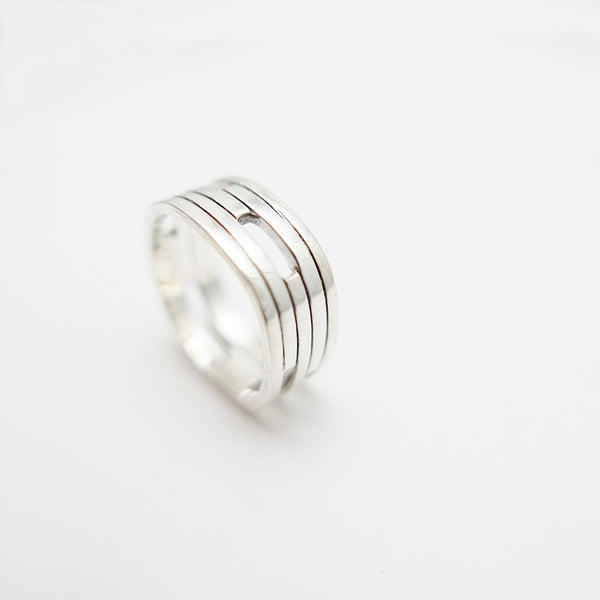 Angle view of silver handmade Vancouver house ring.
